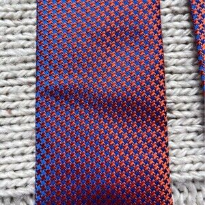 Seaword and stern “ The English Silk Tie” in orange and blue.